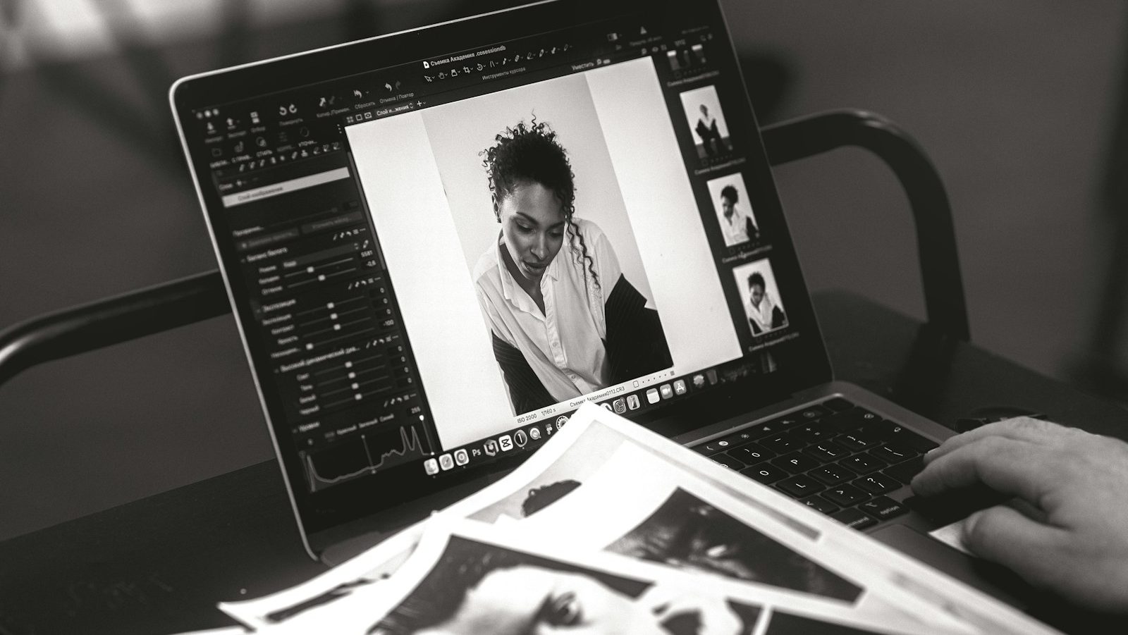 Someone edits a photo on a laptop.
